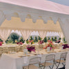 White wedding marquee for hire with table and chairs
