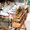 bamboo folding chairs in a wedding reception setup for exotic soirees hire