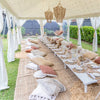 baby shower low boho table setting with cushions under an Exotic Soirees marquee based in Sydney and melbourne