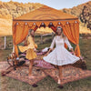 luxury yellow marquee on a farm with fire and friends celebrating