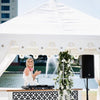 white marquee with a dj playing music at a wedding for exotic soirees