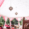 two colourful moroccan pendant lights in a pink tent from exotic soirees bohemian setting