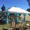 turquoise bohemian tent in a field ready for cooking classes