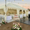 wedding marquee with tables and lots of flowers