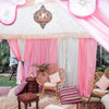 pink and white interior of a luxury kids marquee tent with a moroccan pendant light for hire