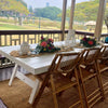 white table and bamboo folding chairs
