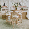 bamboo bar stools matched with bamboo dry bar with padded white cushion in an arabian tent setting