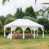 white Arabian marquee tent with bamboo chairs and table setting in a field of lavenders
