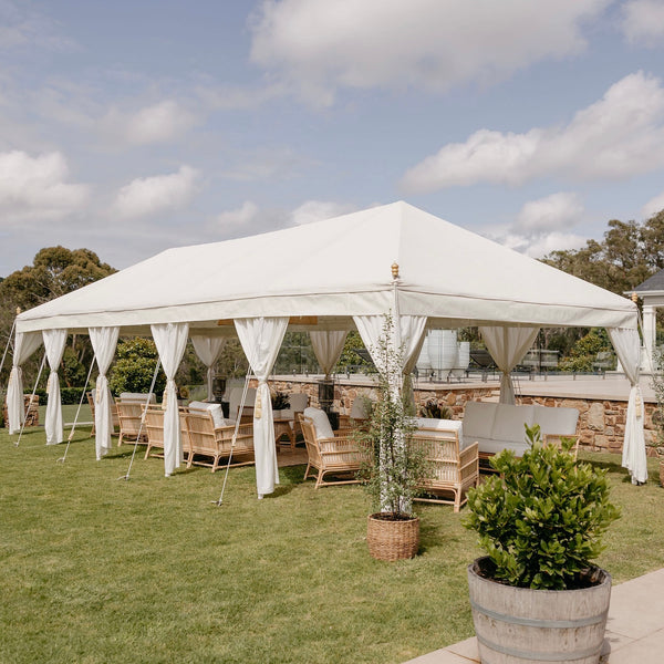 beautiful Indian tent on a grassed area with rattan furniture