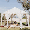 ladies bridal party at the beach under a white arabian bohemian marquee tent full of cushions and rugs with an exotic pop up picnic for hire on the gold coast