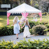 pink and white tent set up for a mad hatters luxury high tea for hire from exotic soirees marquees at teavine on the gold coast and brisbane