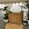 rattan bamboo service bar under an exotic marquee with palms on either side