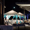 Turquoise Arabian Tents on display at night under beautiful lights