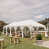 a white Indian Arabian tent or marquee with rattan furniture on a grassed property in the Mornington peninsula